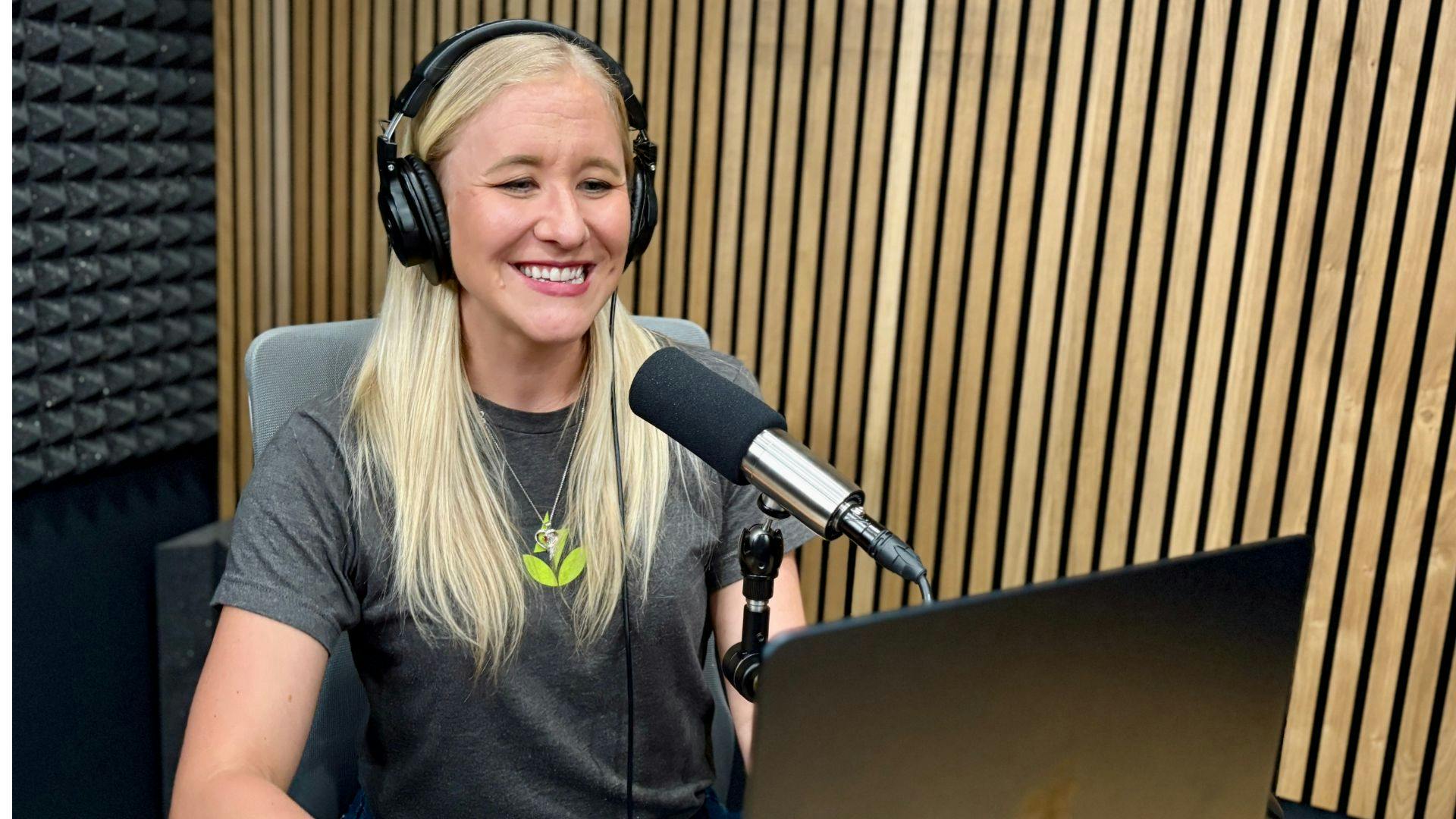 podcaster recording in room with foam panels on wall
